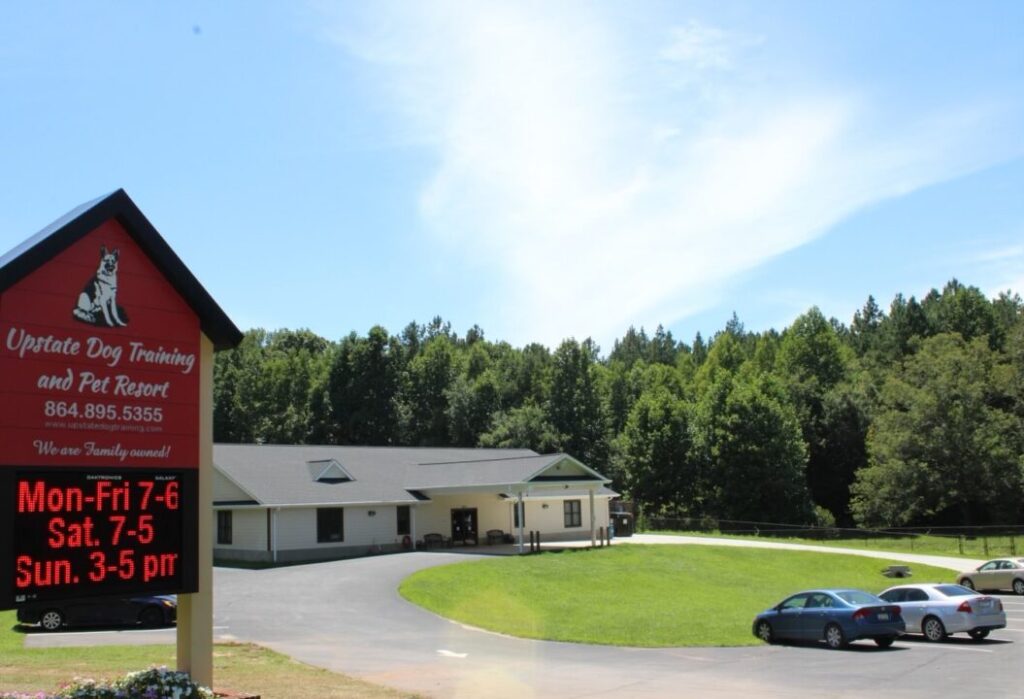 Upstate Dog Training facility front & sign with business hours